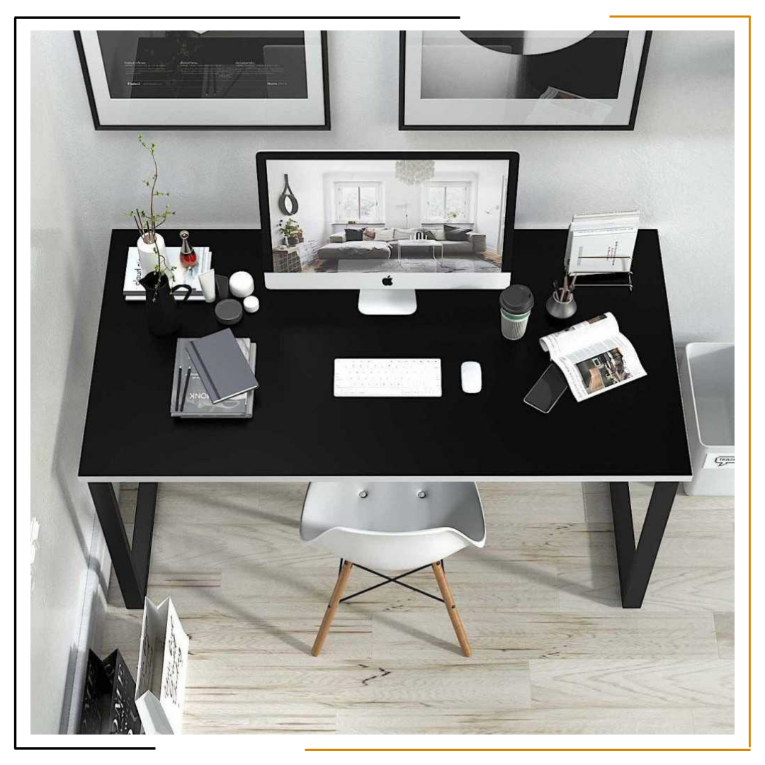 Modern Minimalist Black Desk for Home Office and Study Spaces A sleek, modern black desk set up with a laptop, notebook, coffee mug, desk lamp, wooden wall clock, and green plant, showcasing an organized and elegant workspace.