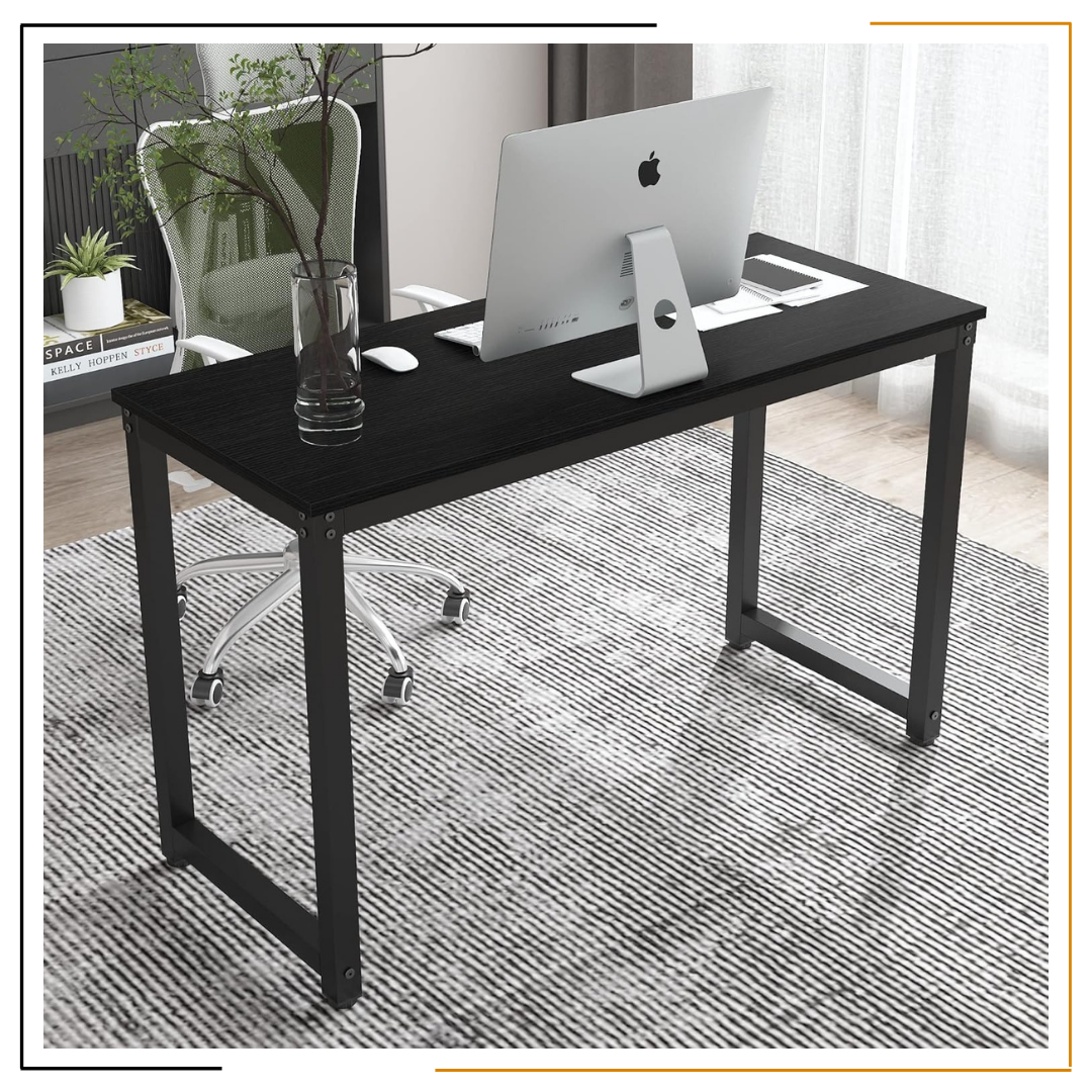 Modern Minimalist Black Desk for Home Office and Study Spaces A sleek, modern black desk set up with a laptop, notebook, coffee mug, desk lamp, wooden wall clock, and green plant, showcasing an organized and elegant workspace.